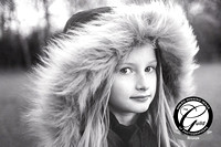 Black and white photo, girl in a hooded jacket. Child and family Suffolk and Essex photographer.